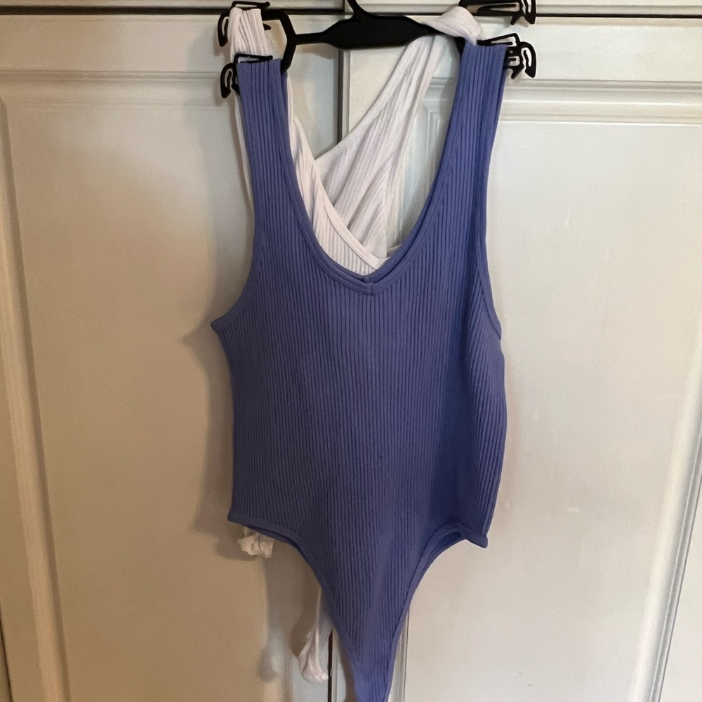 2 piece light blue/purple and white body suits